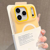 Yellow phone case with camera protection held by a hand against a neutral background