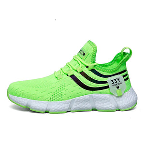 Neon green running shoe with white sole on a white background