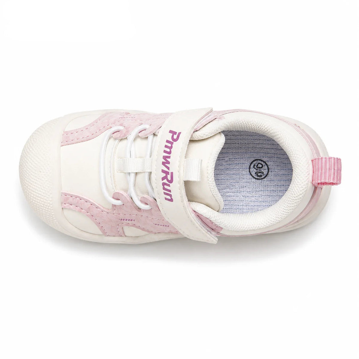 A top-down view of a toddler sneaker in off-white and light pink, featuring a hook-and-loop strap with the brand name printed in pink, white laces, and a pink heel pull tab, set against a plain white background with the PmwRun logo in the top left corner.