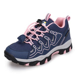A navy blue and pink outdoor hiking shoe with a white and gray midsole and a black outsole, shown on a white background.