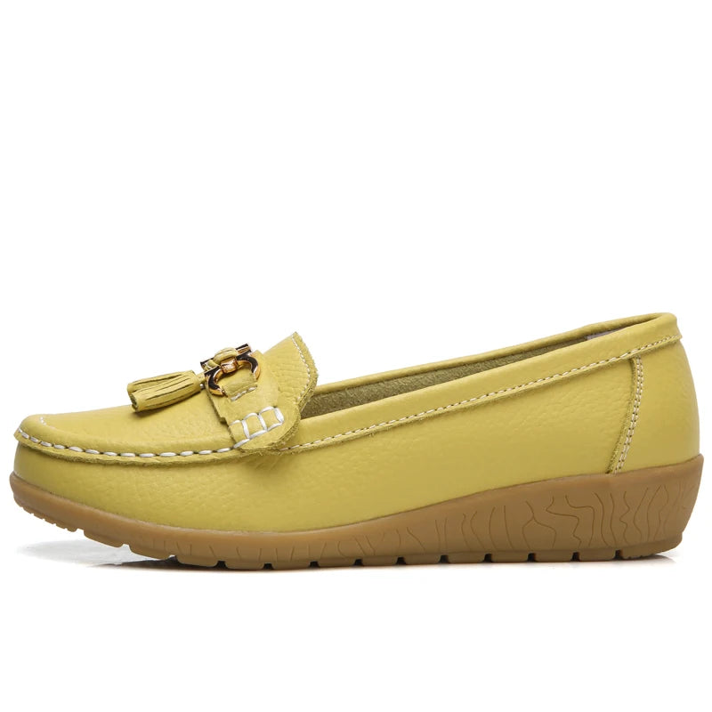 Women's leather loafers with metal tassel detail, round toe, and rubber sole