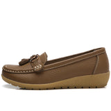 Women's leather loafers with metal tassel detail, round toe, and rubber sole