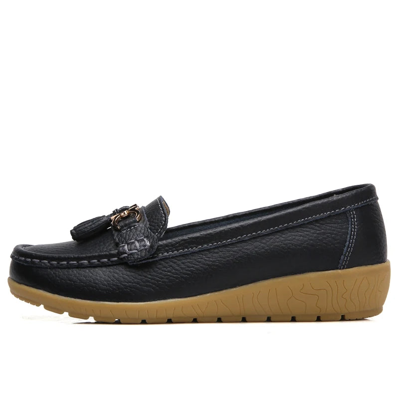 Women's leather loafers with metal tassel detail, round toe, and rubber sole