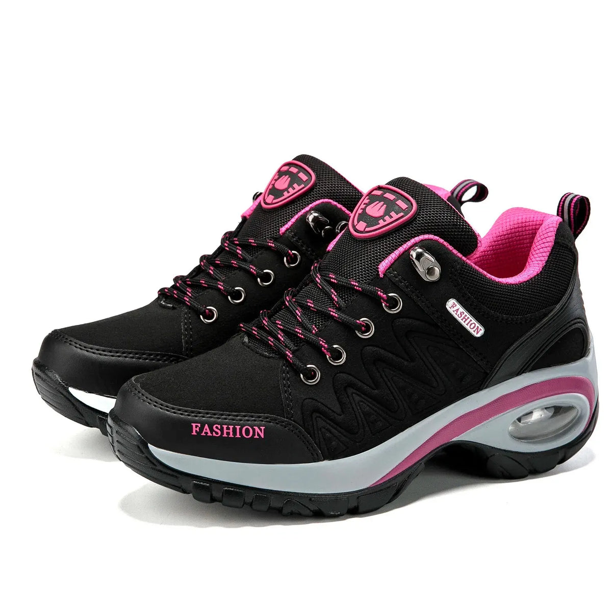 Black and pink fashion sneakers on a white background