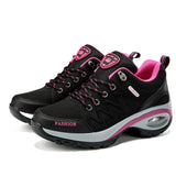 Black and pink fashion sneakers on a white background