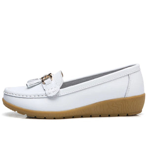 Women's leather loafers with metal tassel detail, round toe, and rubber sole