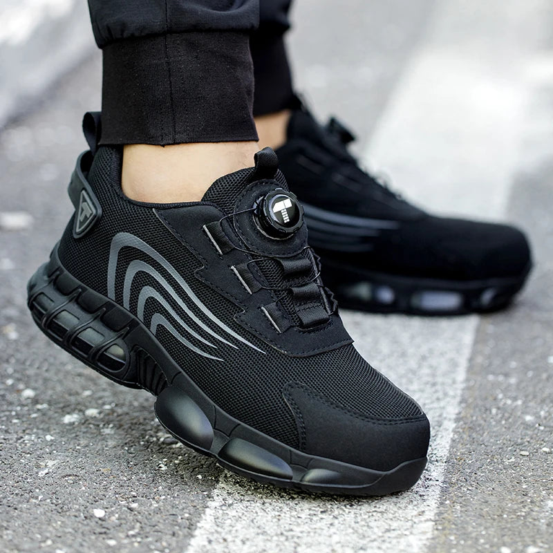 Black work shoes with gray accents worn on a road surface