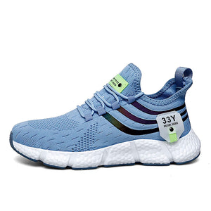 Blue running shoe with white sole on a white background