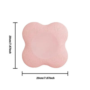 Pink cushion with measurements on a white background