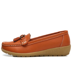 Women's leather loafers with metal tassel detail, round toe, and rubber sole