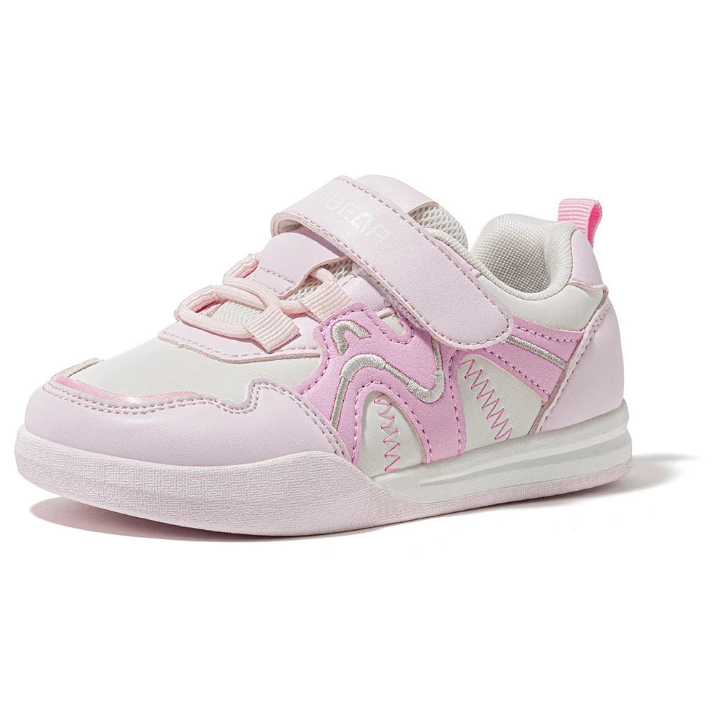 A light pink and white toddler sneaker with a hook-and-loop strap closure, shown from a side profile on a white background.