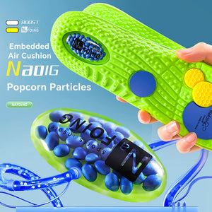 Green shoe with embedded air cushion and popcorn particles on a blue background