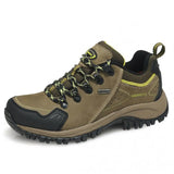 Brown hiking shoe with black sole on a white background