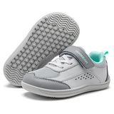 A pair of children's casual sneakers in light gray and white, with one shoe showing the textured gray outsole and the other showing the side profile with a hook-and-loop strap and mint green lining.