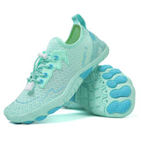 Light blue running shoes with white laces on a white background