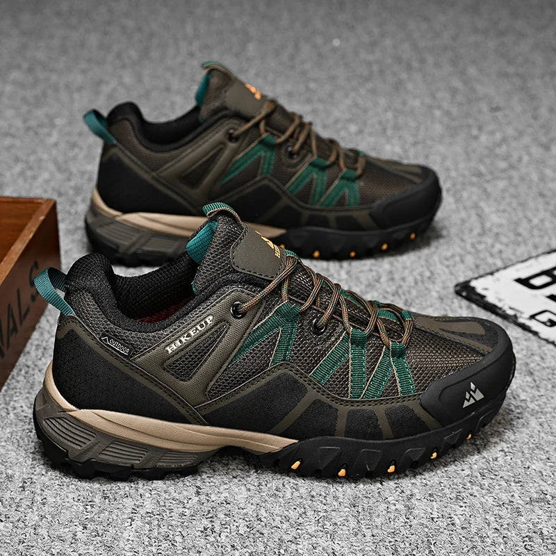 Pair of hiking shoes with green and black design on a textured surface