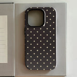 iPhone case with white polka dots on a gray background