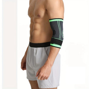 Person wearing a black and green elbow brace on a white background