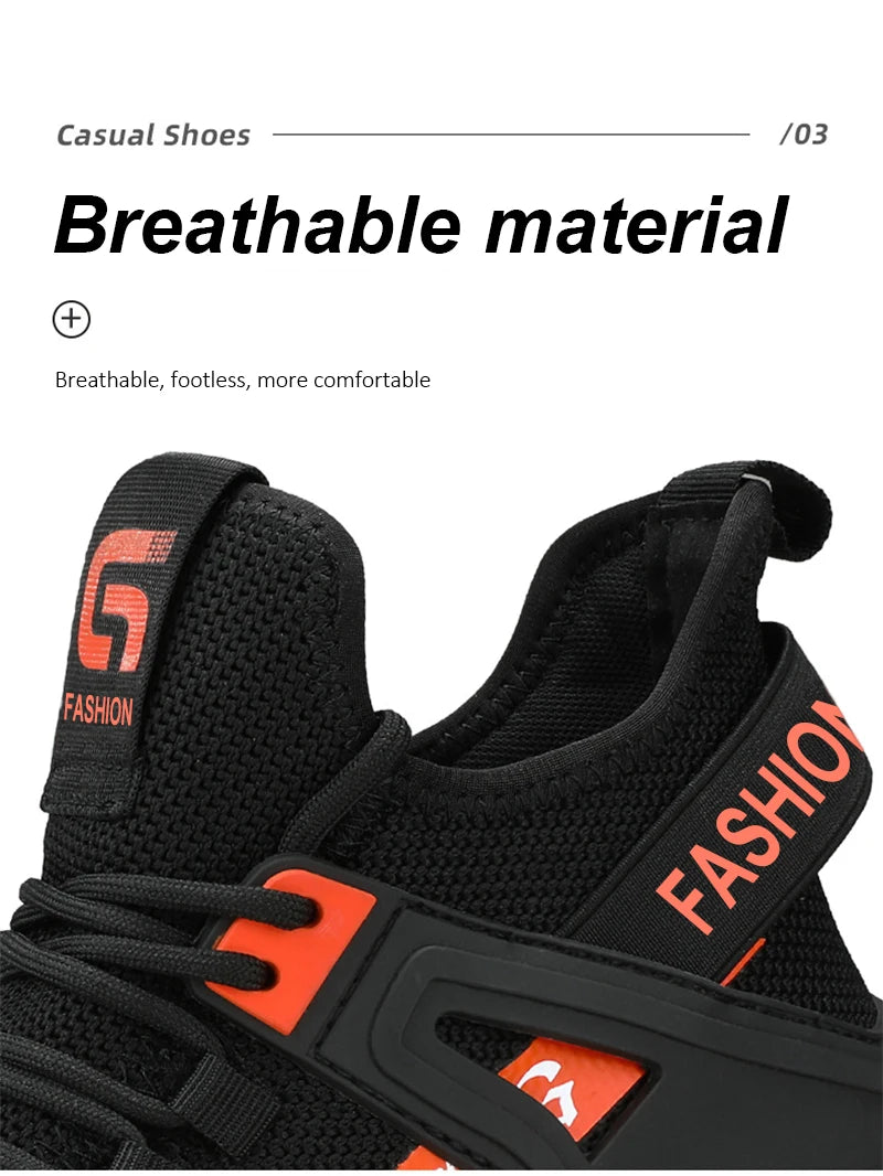 Black and orange safety shoes with breathable material feature on a white background