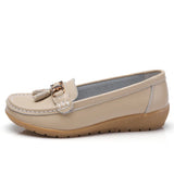 Women's leather loafers with metal tassel detail, round toe, and rubber sole