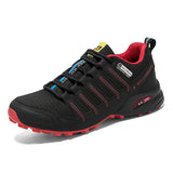Black and red athletic shoe on a white background