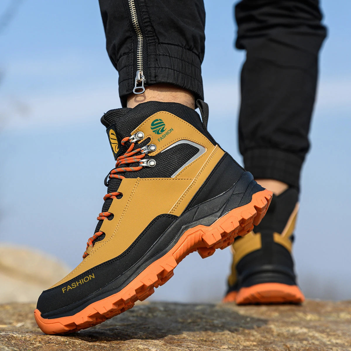 safety boots with orange soles on a blurred natural background