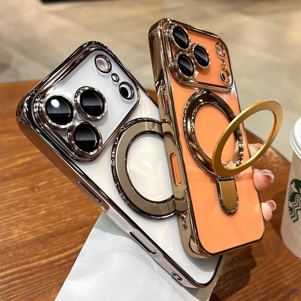 Two Transparent Plating iPhone Cases with ring holders on a wooden surface