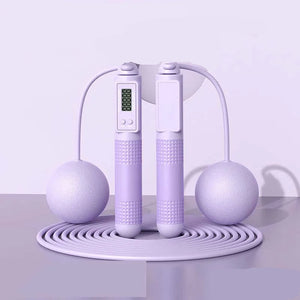 Purple jump rope with digital display on a white background, labeled 'Dual purpose' and 'Purple'.