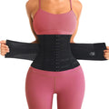 Person wearing a black waist trainer corset belt for tummy control with pink sports bra and leggings, showing different angles on a white background.