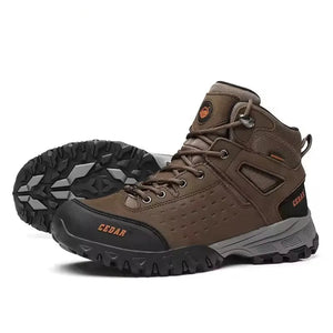 A pair of mid-cut outdoor hiking boots in brown and black, with one boot showing the side profile and the other showing the treaded outsole.