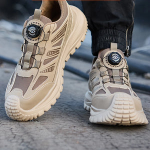 Beige safety work shoes with unique design elements on a blurred background