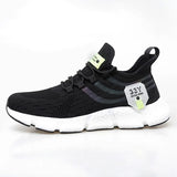 Black running shoe with white sole on a white background