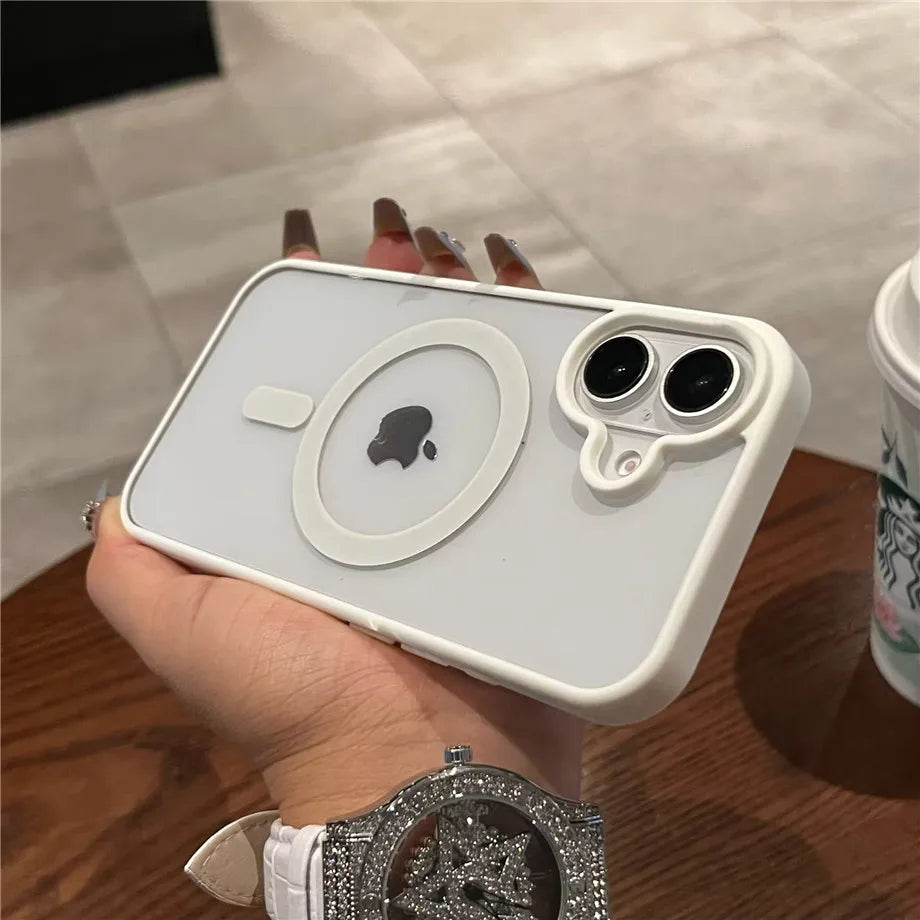 Hand holding Luxury Magnetic Transparent Bumper Case for iPhone 11–17 on a wooden surface