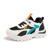 Children's sneaker with black, white, and blue design on a white background