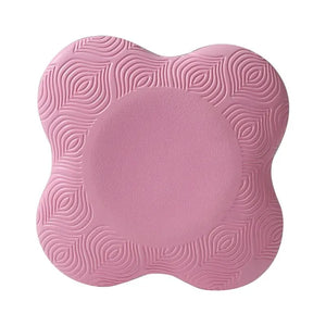 Pink cushion with textured design on a white background