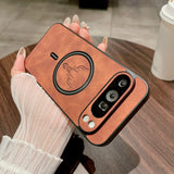 Brown Leather Magnetic Case for Pixel with a deer design held by a person on a wooden table.