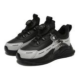 Black and gray sneakers with a brand logo on a white background