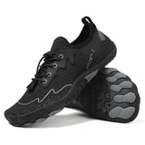 Black athletic shoe with gray sole on a white background
