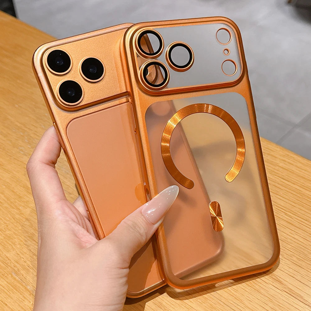 Hand holding a reflective orange phone case on a wooden surface