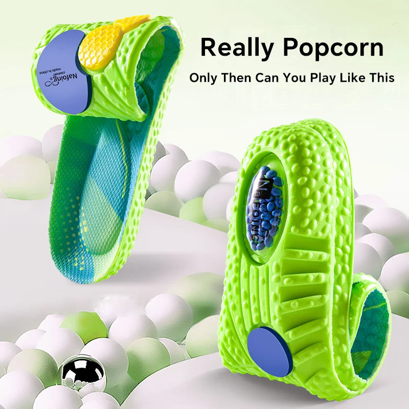 Green and blue pet toy with textured surface and ball inside, surrounded by white balls on a light green background.