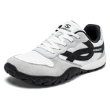 White and gray sneaker with black accents on a white background