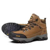 Brown hiking boot with black sole on a white background
