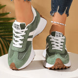 Green sneakers with white laces and 'Stay Real' branding on a neutral background