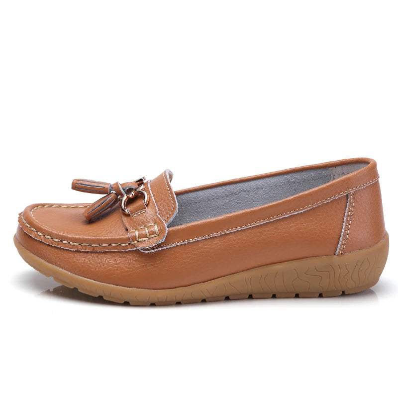 Women's leather loafers with metal tassel detail, round toe, and rubber sole