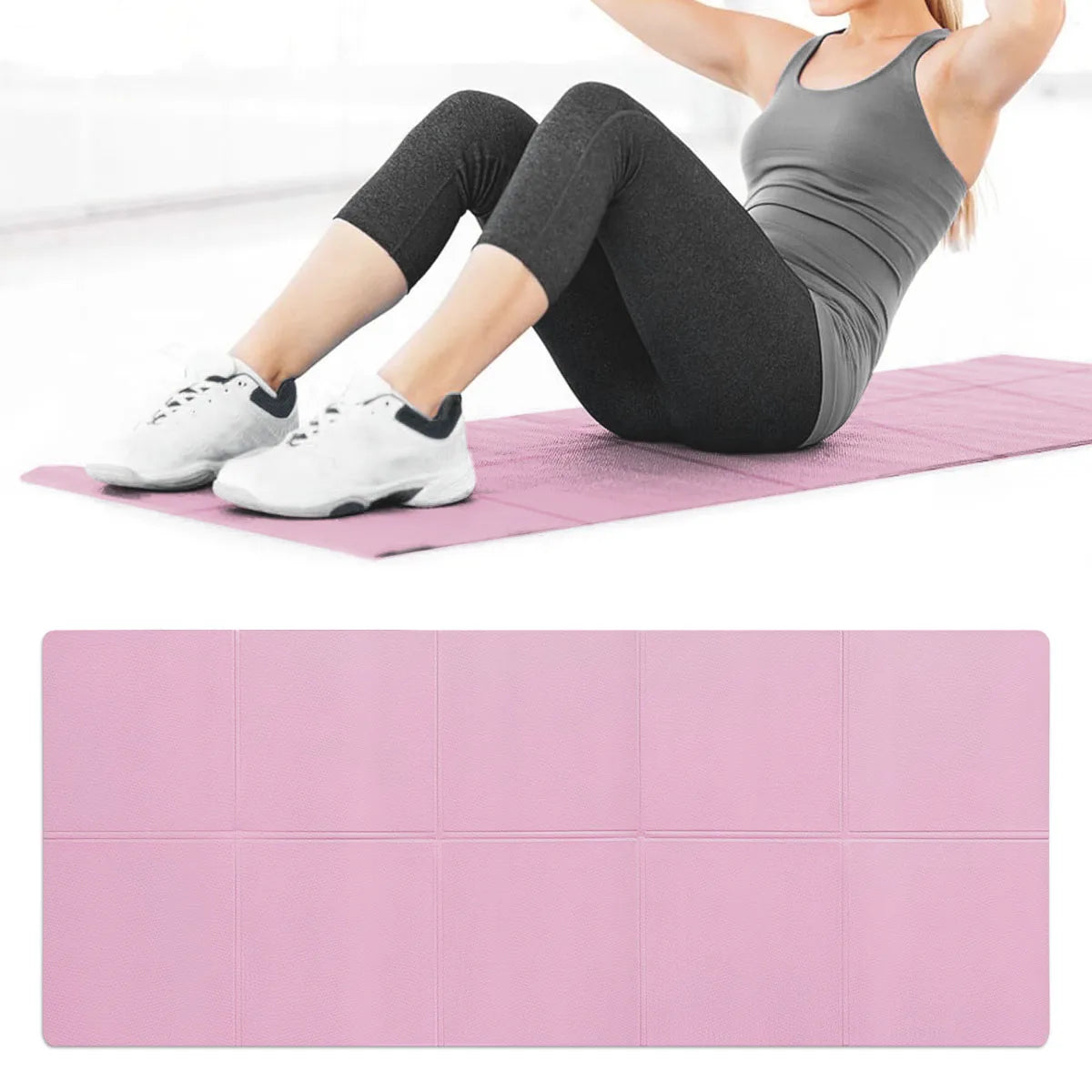 Person exercising on a pink yoga mat with a pink block in the foreground