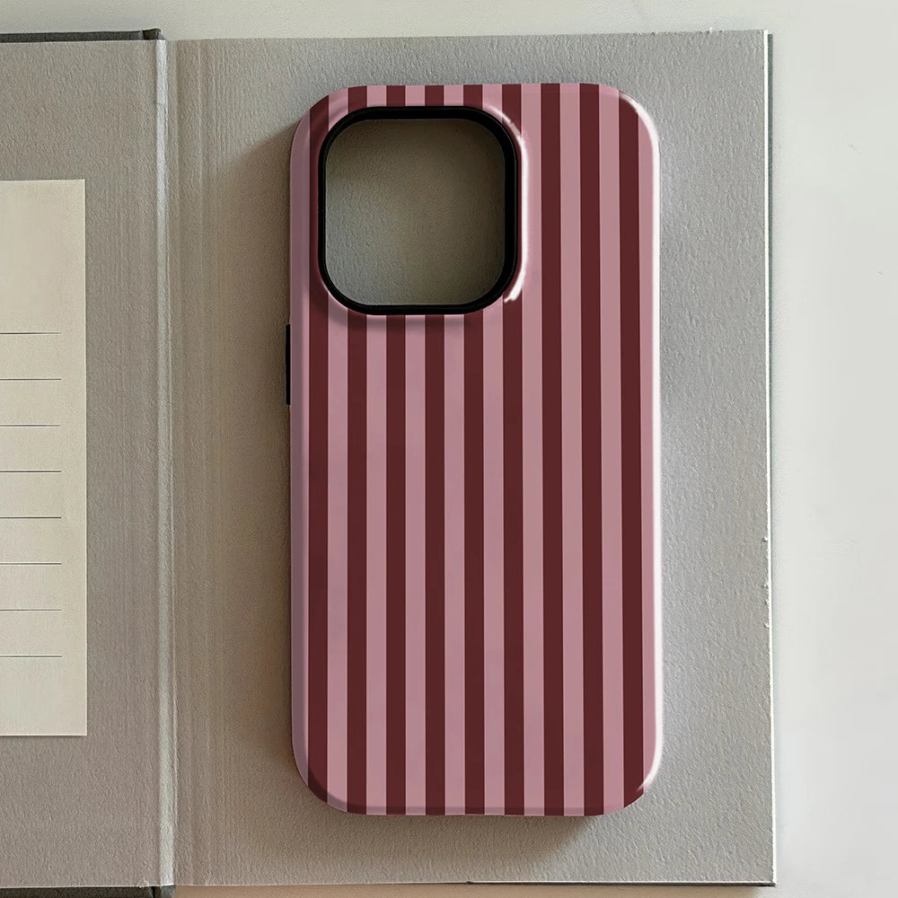Pink and white striped iphone case on a gray surface