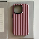 Pink and white striped iphone case on a gray surface