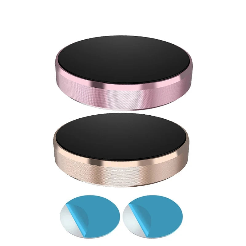 Two round metal holders with black tops and rose gold bases on a white background.