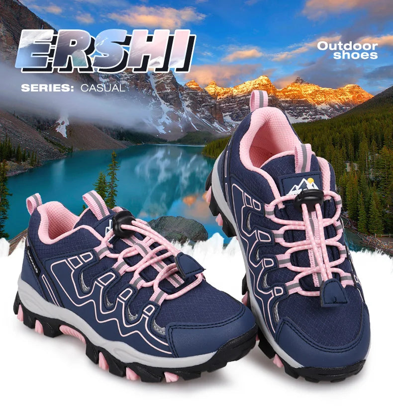A pair of navy blue and pink outdoor casual hiking shoes displayed against a scenic mountain lake background. The shoes feature navy blue mesh and synthetic overlays, pink laces, and pink lining and 'Outdoor shoes' text visible in the top corners.