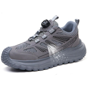 Gray safety work shoe with black accents on a white background